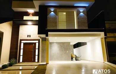 Imagem: A casa possui 3 Dormitórios, 5 Banheiros, 4 Vagas na garagem