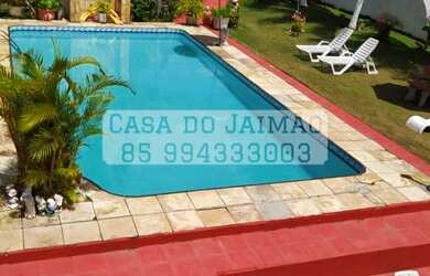 Imagem: A casa possui 3 Dormitórios, Acomodam 25 pessoas, 5 Vagas na