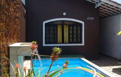 Imagem: A casa possui 2 Dormitórios e 1 Vaga na garagem e está localizado