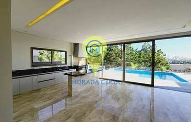 Imagem: A casa possui 4 Dormitórios, 5 Banheiros, 5 Vagas na garagem