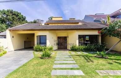 Imagem: A casa possui 4 Dormitórios, 5 Banheiros, 5 Vagas na garagem