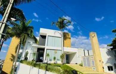 Imagem: A casa possui 4 Dormitórios, 5 Banheiros, 5 Vagas na garagem