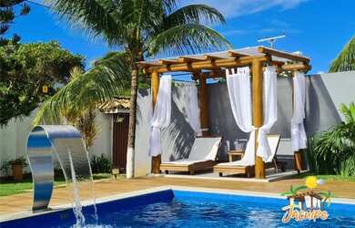 Imagem: A casa possui 4 Dormitórios, 5 Vagas na garagem e está localizado