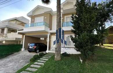 Imagem: A casa em condomínio possui 4 Dormitórios, 3 Banheiros, 2