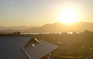 Imagem: A casa possui 2 Dormitórios, 3 Banheiros, 4 Vagas na garagem