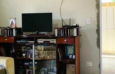 Imagem: A casa possui 3 Dormitórios, 2 Banheiros, 3 Vagas na garagem