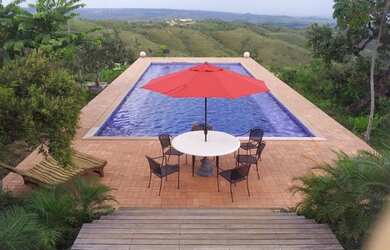 Imagem: A casa possui 4 Dormitórios, 5 Banheiros, 5 Vagas na garagem