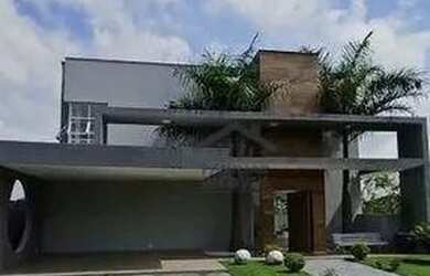 Imagem: A casa possui 3 Dormitórios, 4 Banheiros, 3 Vagas na garagem