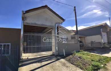 Imagem: A casa possui 3 Dormitórios, 1 Banheiro, 1 Vaga na garagem