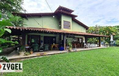 Imagem: A casa em condomínio possui 5 Dormitórios, 5 Banheiros, 3