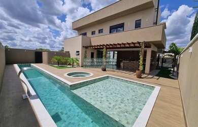 Imagem: A casa em condomínio possui 4 Dormitórios, 5 Banheiros, 4