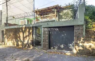 Imagem: A casa possui 3 Dormitórios, 2 Banheiros, 1 Vaga na garagem