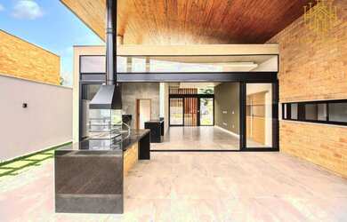 Imagem: A casa possui 3 Dormitórios, 5 Banheiros, 4 Vagas na garagem