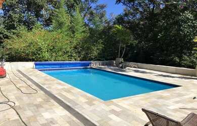 Imagem: A casa em condomínio possui 4 Dormitórios, 5 Banheiros, 5