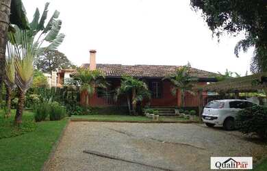 Imagem: A casa possui 3 Dormitórios, 3 Banheiros, 4 Vagas na garagem