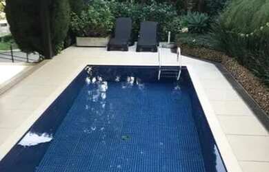 Imagem: A casa em condomínio possui 4 Dormitórios, 5 Banheiros, 5