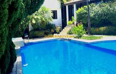 Imagem: A casa possui 4 Dormitórios, 5 Banheiros, 4 Vagas na garagem