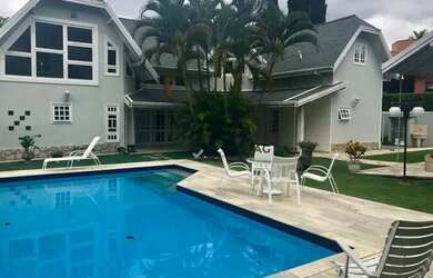 Imagem: A casa em condomínio possui 4 Dormitórios, 5 Banheiros, 5