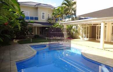 Imagem: A casa em condomínio possui 4 Dormitórios, 5 Banheiros, 4