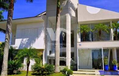 Imagem: A casa possui 5 Dormitórios, 5 Banheiros, 4 Vagas na garagem