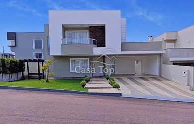 Imagem: A casa possui 3 Dormitórios, 3 Banheiros, 2 Vagas na garagem