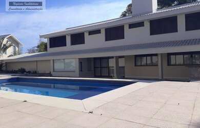 Imagem: A casa em condomínio possui 4 Dormitórios, 5 Banheiros, 2