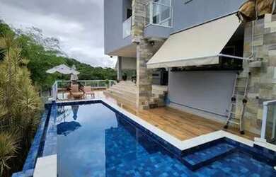 Imagem: A casa em condomínio possui 4 Dormitórios, 5 Banheiros, 4