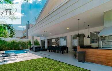 Imagem: A casa em condomínio possui 5 Dormitórios, 5 Banheiros, 5