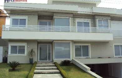 Imagem: A casa em condomínio possui 5 Dormitórios, 5 Banheiros, 5