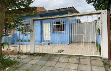 Imagem: A casa possui 5 Dormitórios, 2 Banheiros, 4 Vagas na garagem