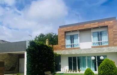 Imagem: A casa em condomínio possui 5 Dormitórios, 5 Banheiros, 2