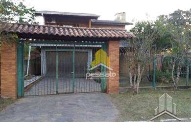 Imagem: A casa possui 2 Dormitórios, 1 Banheiro, 2 Vagas na garagem