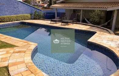 Imagem: A casa possui 4 Dormitórios, 5 Banheiros, 5 Vagas na garagem