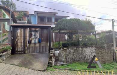 Imagem: A casa possui 3 Dormitórios, 2 Banheiros, 5 Vagas na garagem