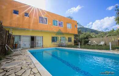 Imagem: A casa possui 5 Dormitórios, 5 Banheiros, 5 Vagas na garagem