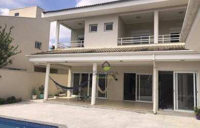 Imagem: A casa em condomínio possui 5 Dormitórios, 5 Banheiros, 4