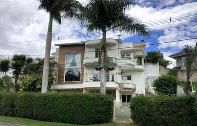 Imagem: A casa em condomínio possui 5 Dormitórios, 5 Banheiros, 5