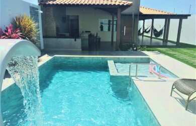 Imagem: A casa possui 3 Dormitórios, 3 Banheiros, 3 Vagas na garagem