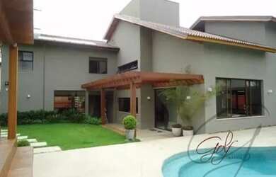 Imagem: A casa possui 5 Dormitórios, 5 Banheiros, 5 Vagas na garagem