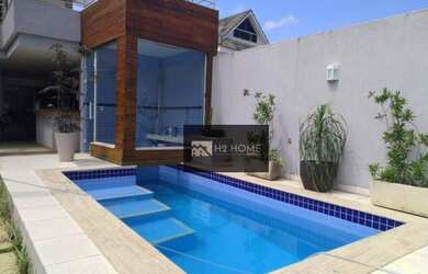 Imagem: A casa em condomínio possui 4 Dormitórios, 5 Banheiros, 2