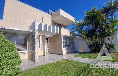 Imagem: A casa possui 5 Dormitórios, 3 Banheiros, 4 Vagas na garagem