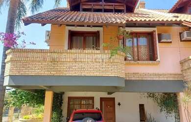 Imagem: A casa em condomínio possui 3 Dormitórios, 3 Banheiros, 2