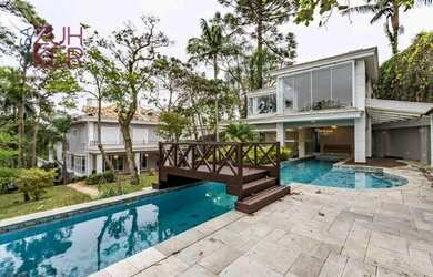 Imagem: A casa possui 5 Dormitórios, 5 Banheiros, 5 Vagas na garagem