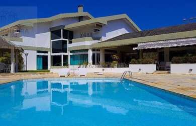 Imagem: A casa possui 5 Dormitórios, 5 Banheiros, 5 Vagas na garagem