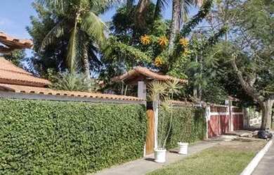 Imagem: A casa possui 3 Dormitórios e 4 Vagas na garagem e está localizado