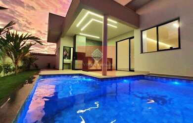 Imagem: A casa possui 3 Dormitórios, 5 Banheiros, 2 Vagas na garagem