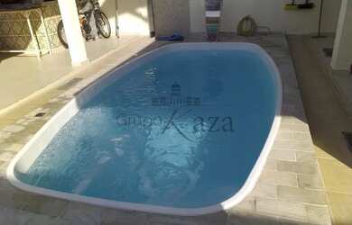 Imagem: A casa possui 3 Dormitórios, 4 Banheiros, 3 Vagas na garagem