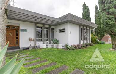 Imagem: A casa possui 4 Dormitórios, 5 Banheiros, 5 Vagas na garagem