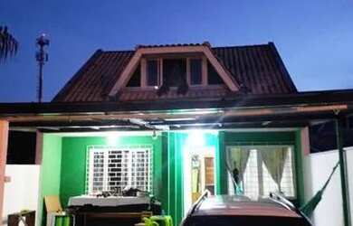 Imagem: A casa possui 3 Dormitórios, 4 Vagas na garagem e 150m² de