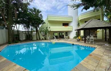 Imagem: A casa possui 5 Dormitórios, 5 Banheiros, 4 Vagas na garagem